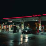 cars parked in front of store during night time