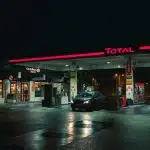 cars parked in front of store during night time